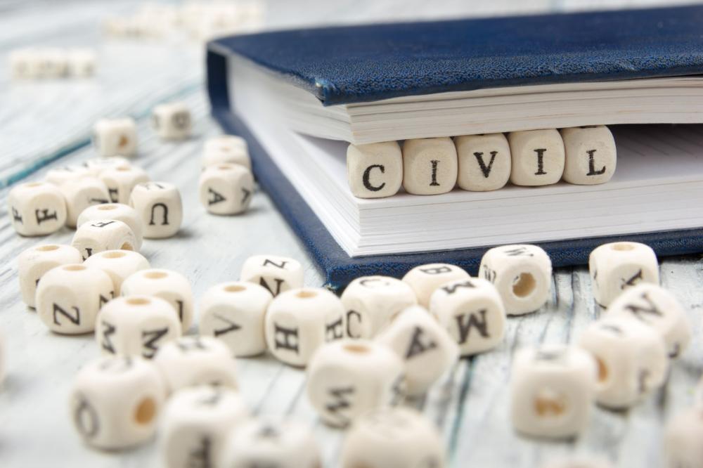 Civil écrit avec des cubes en bois dans un livre